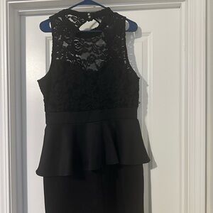 Black lined laced topped peplum dress. Can be worn during cocktail event.